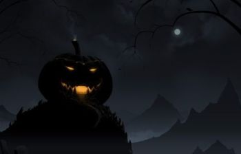 Dark pumpkin glowing orange on a hill