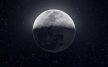 Full moon against starry sky