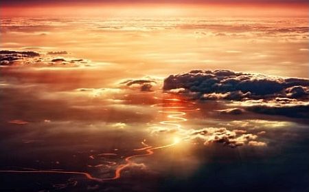 View of river from above the clouds