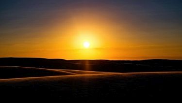 Sunset over sand dunes